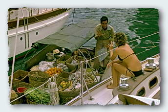 Freddy buying vegies from a vendor right from the boat.